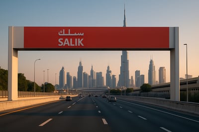 Dubai toll road with Salik gate and city skyline Dubai toll road with Salik gate and city skyline